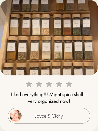 Customer review showing neatly organized spice jars with bamboo lids in a kitchen drawer
